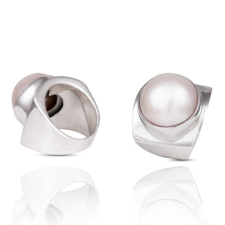 A ring with a smooth white Mabe pearl set in a modern angular silver band with a high polish finish.