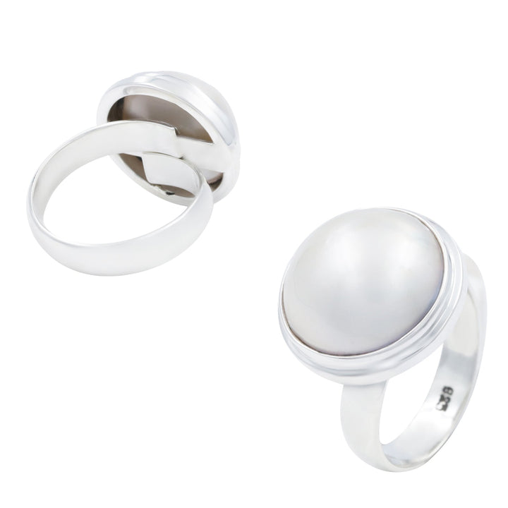 An image showing two views of a white Mabe pearl ring with a silver band, displayed against a white background.