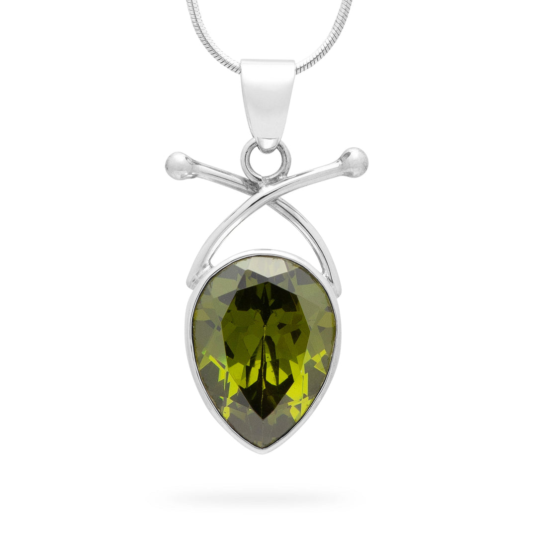 Silver pendant with a green gemstone on a white background
