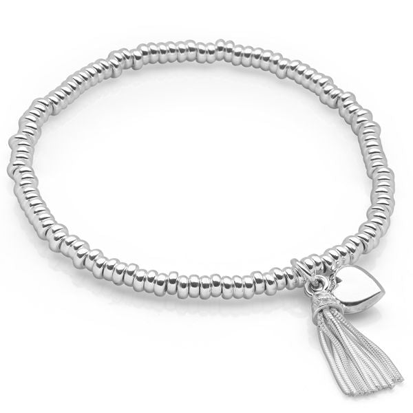 A silver beaded bracelet with a miniature sterling silver tassel and a silver heart charm, with a high polish finish.