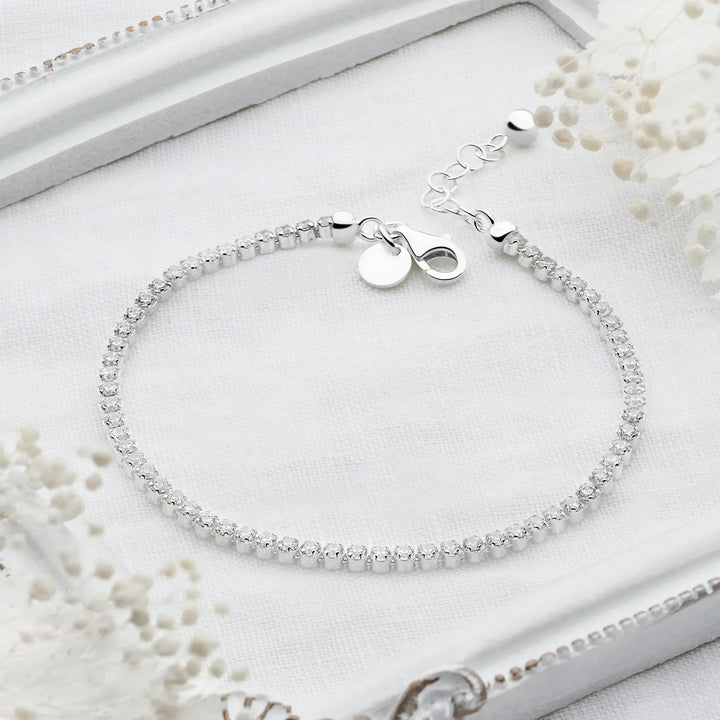 Sterling silver tennis bracelet with continuous row of sparkling cubic zirconia stones