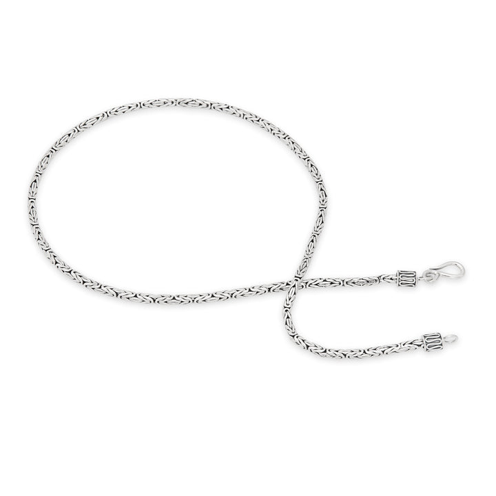 A 925 sterling silver necklace with a Borobudur weave design, featuring a high polish and oxidised finish.