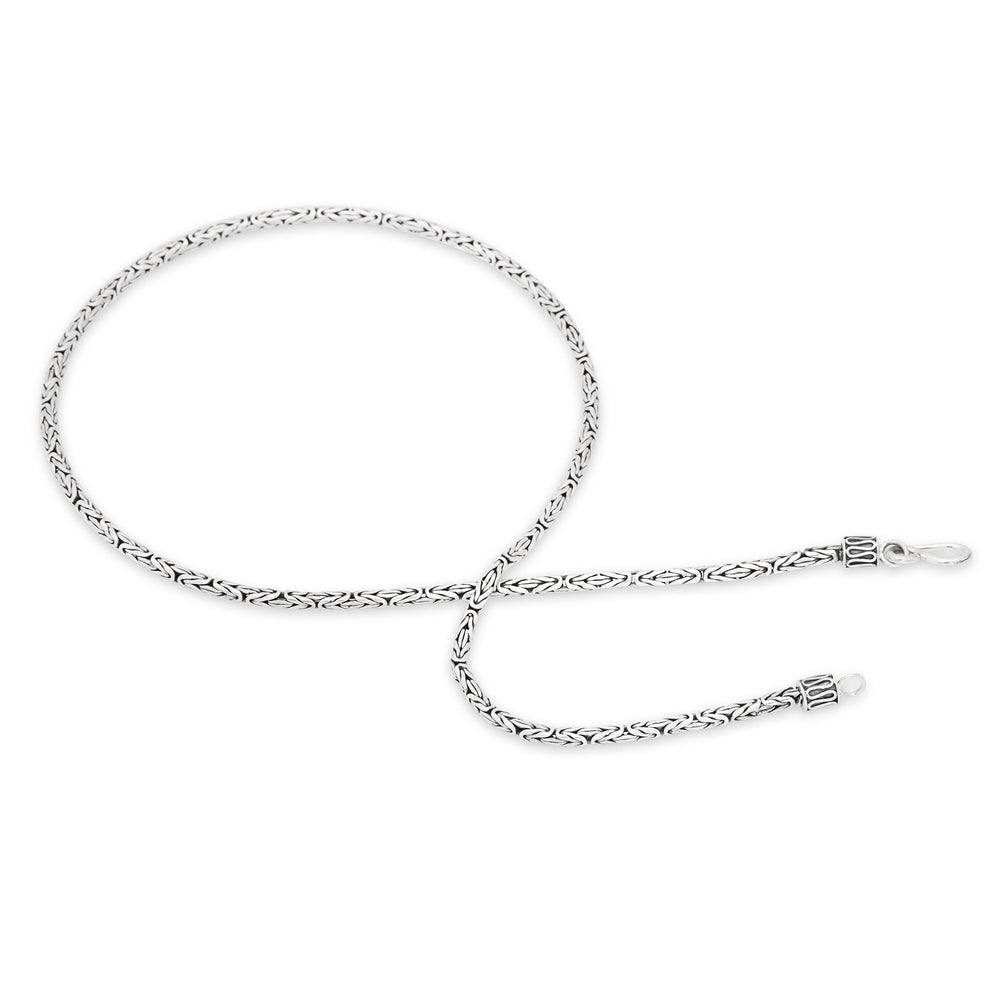 A 925 sterling silver necklace with a Borobudur weave design, featuring a high polish and oxidised finish.