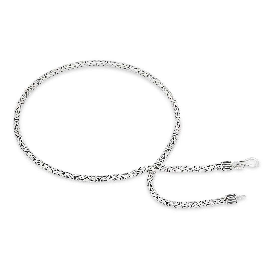 A sterling silver necklace with a serpentine chain design and a high polish finish.