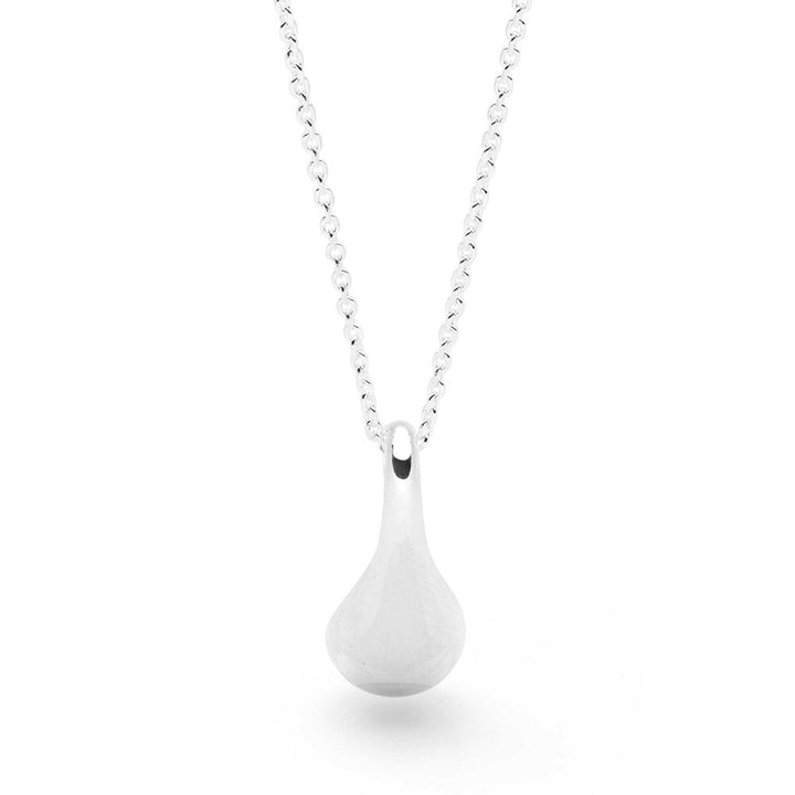 Close up image of a silver drop-shaped pendant necklace with a high polish finish, displayed against white background