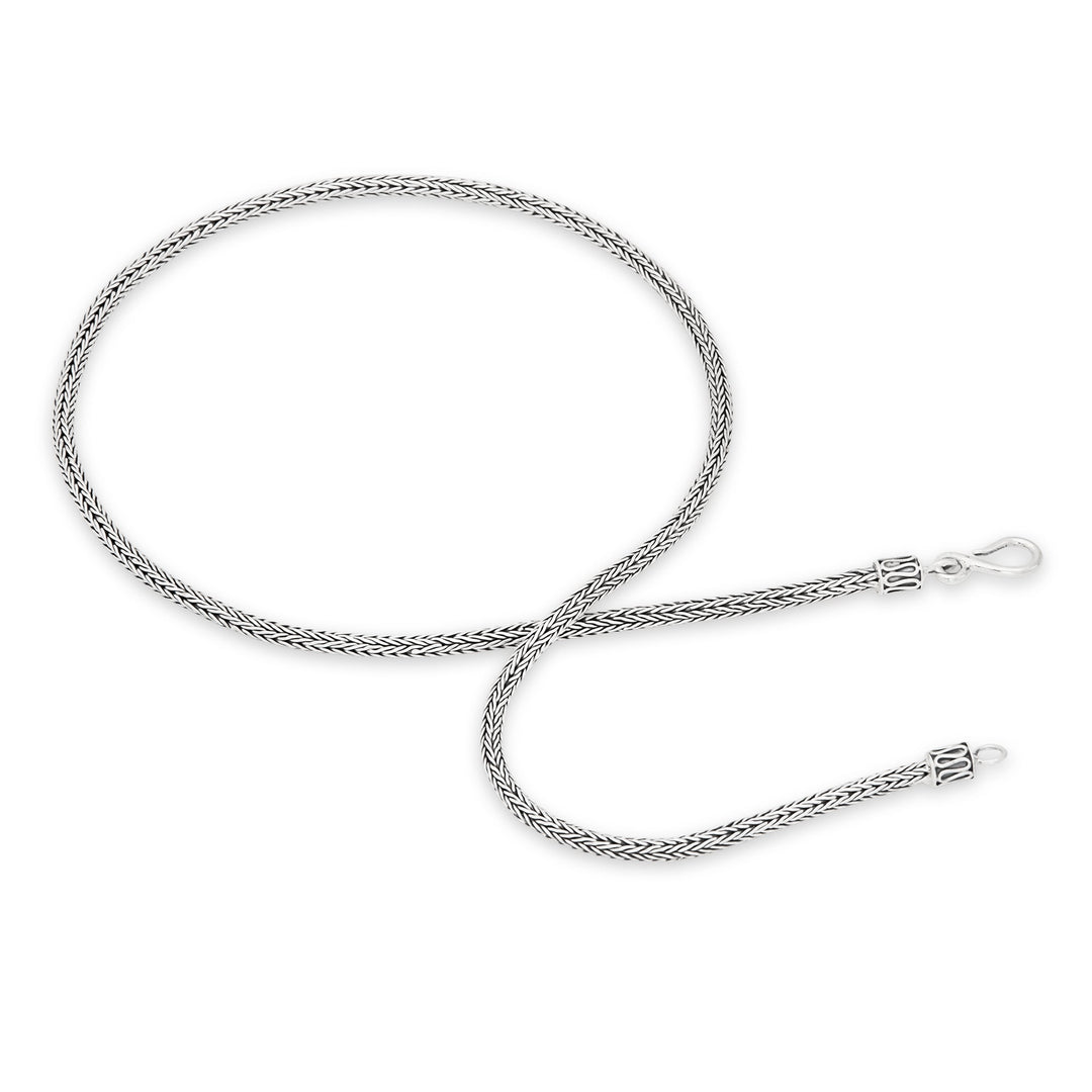 A 925 sterling silver necklace with a Tulang Naga chain design, featuring a high polish and oxidised finish.