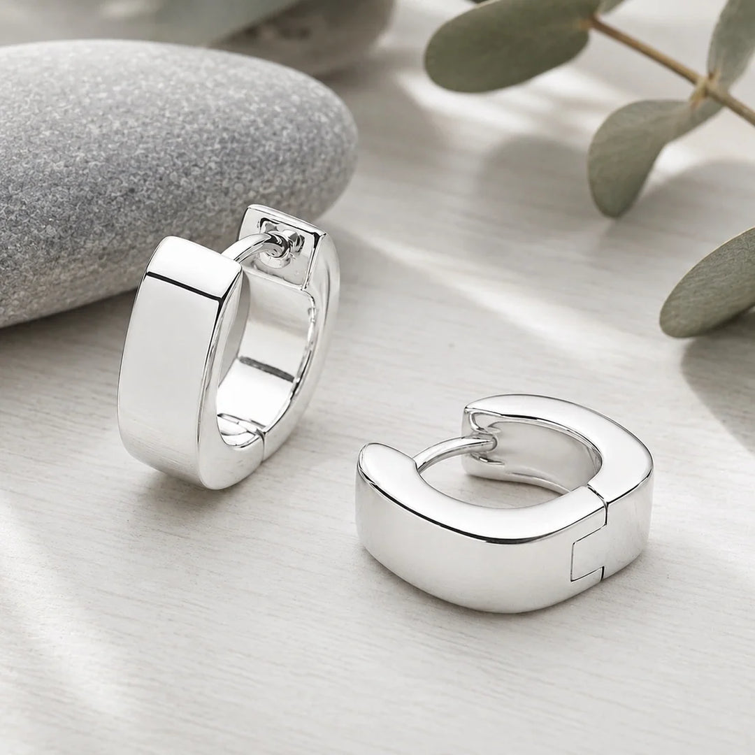 Sterling silver rectangular thick hoop earrings, clasp back, high polish finish. 