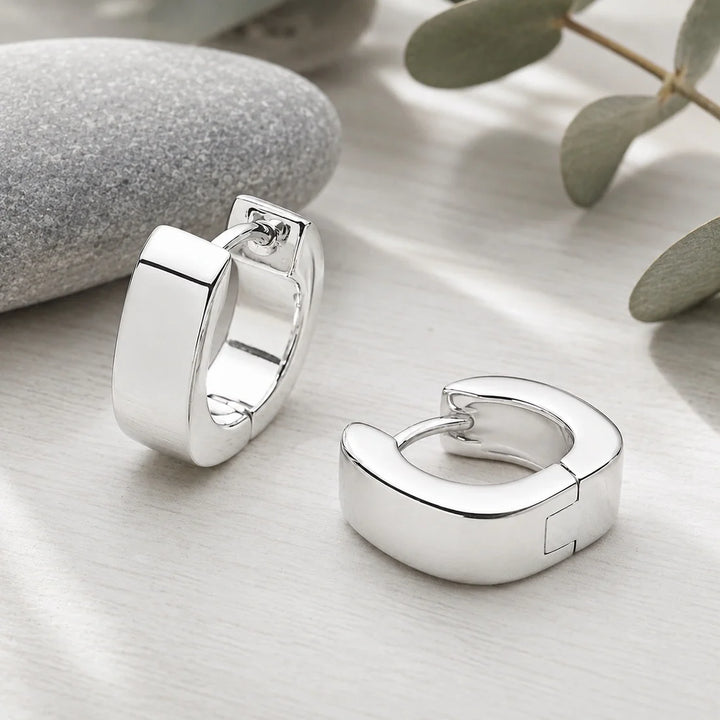 Sterling silver rectangular thick hoop earrings, clasp back, high polish finish. 