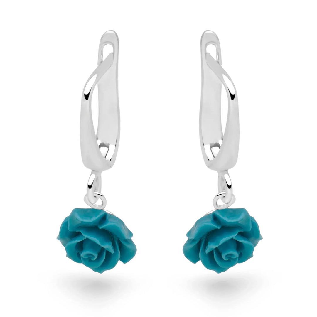Pair of turquoise rose earrings on a white background