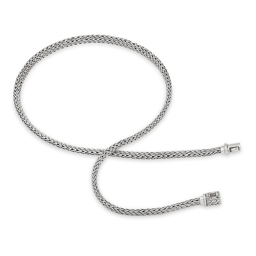 A sterling silver necklace with a Tulang Naga weave design and a clasp, displayed against a white background.