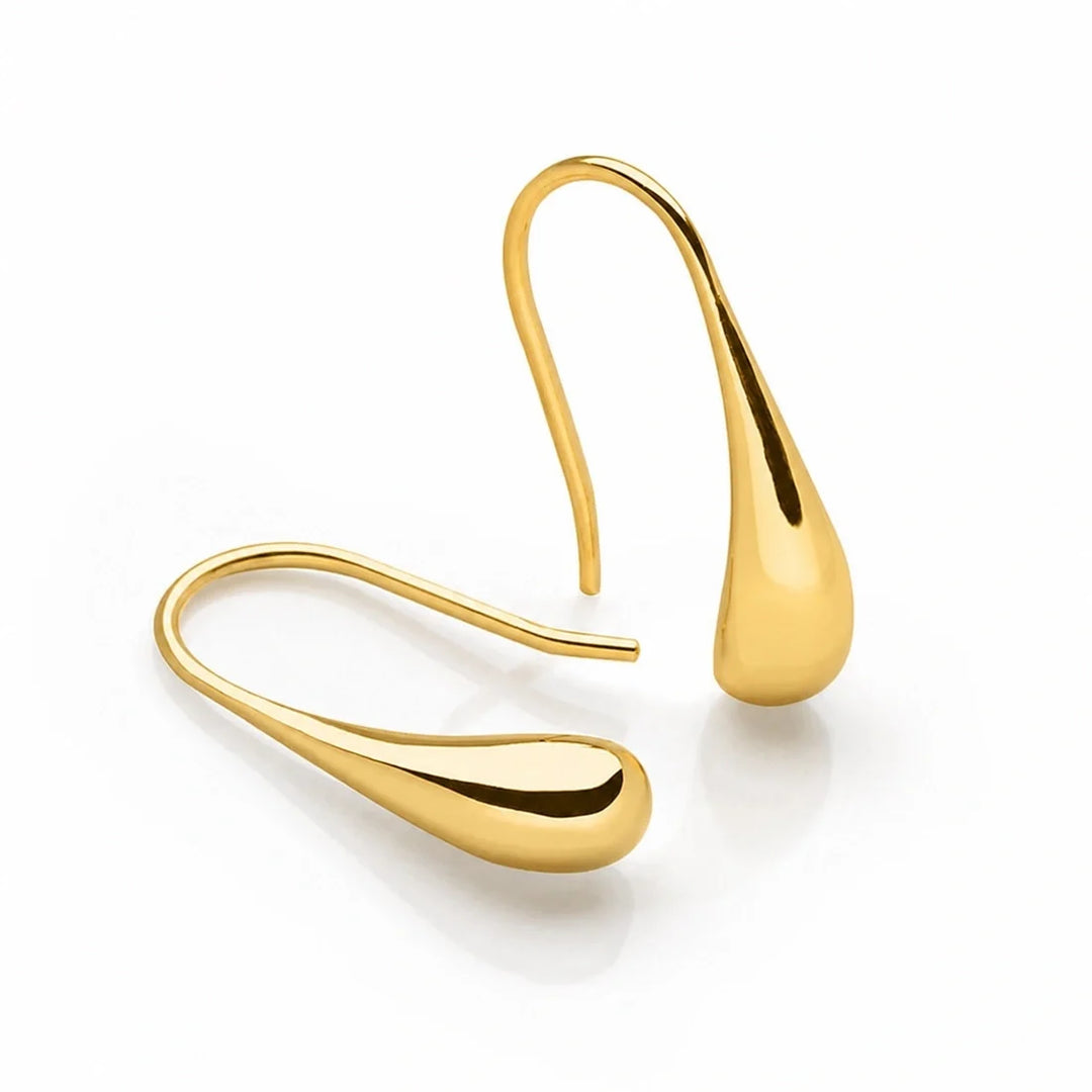 Smooth designer 14k gold teardrop earringswith a glossy finish and eye catching shine. 