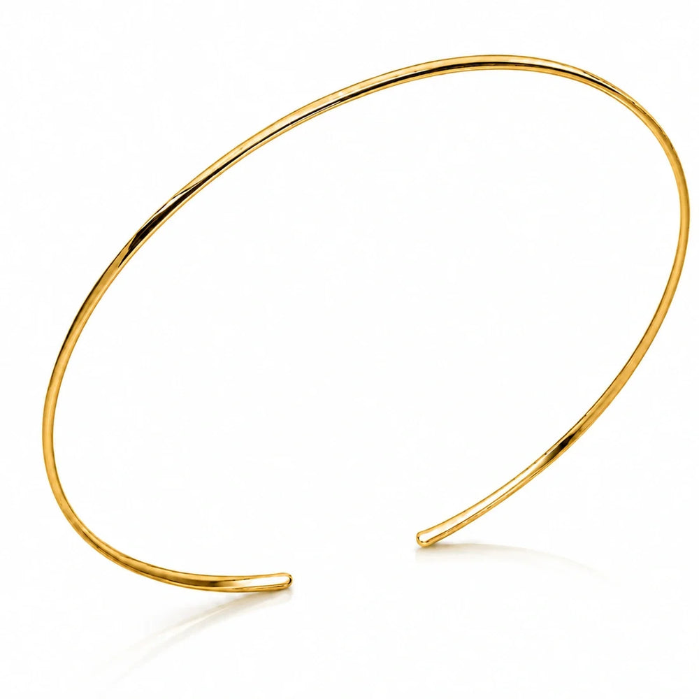Slender open back choker in a high polish 14k gold plated finish.