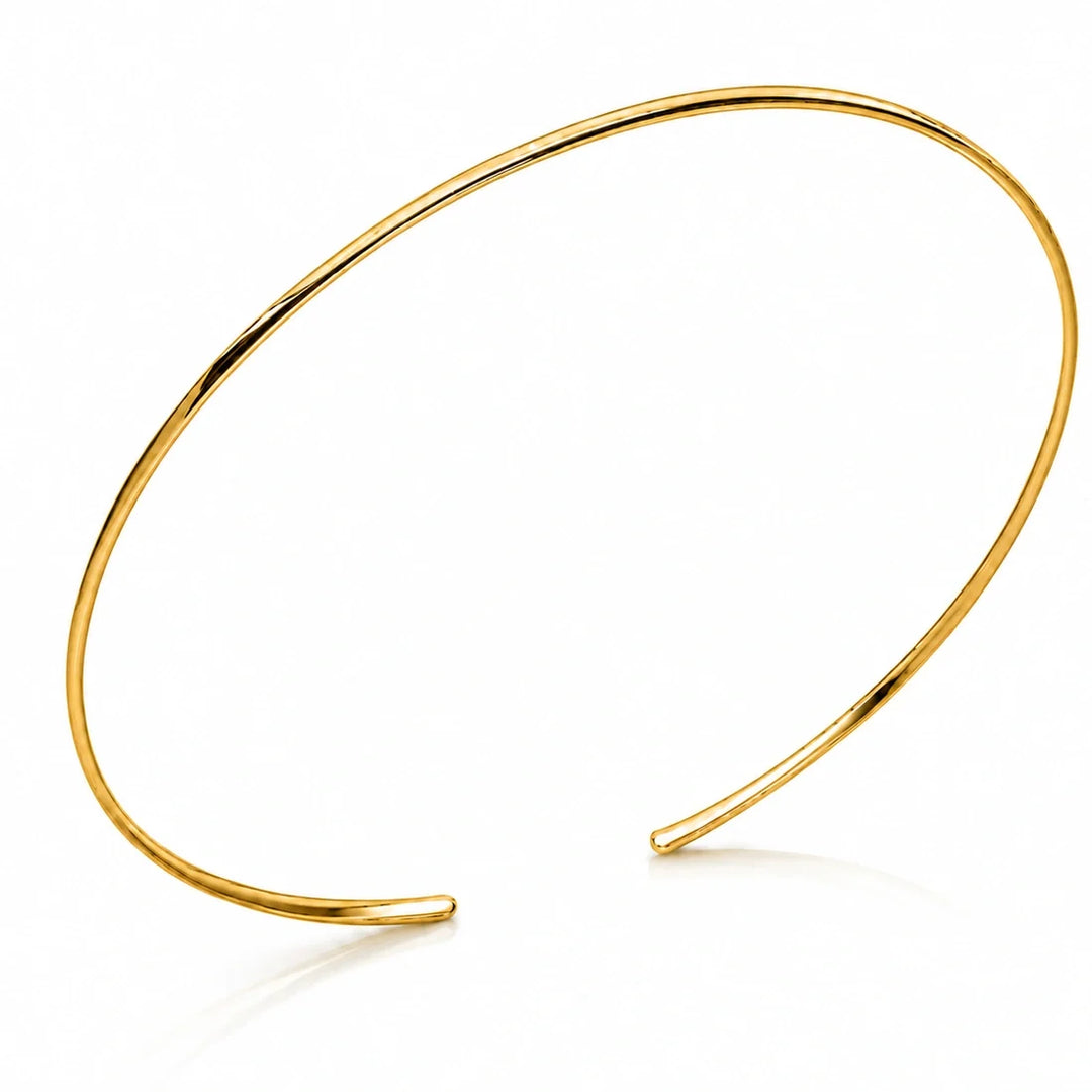 Slender open back choker in a high polish 14k gold plated finish.