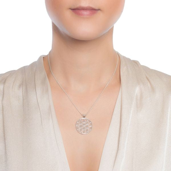 925 sterling silver flowers of life pendant on silver curb chain on female model