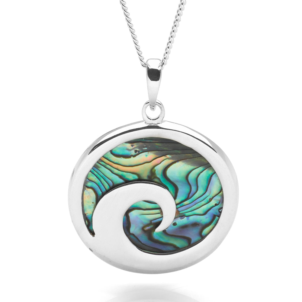 A silver pendant necklace featuring a rolling wave design with a abalone sea shell inlay, on a curb chain.