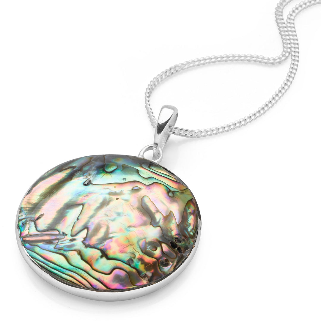 A silver pendant necklace featuring a rolling wave design with a abalone sea shell inlay, on a curb chain.