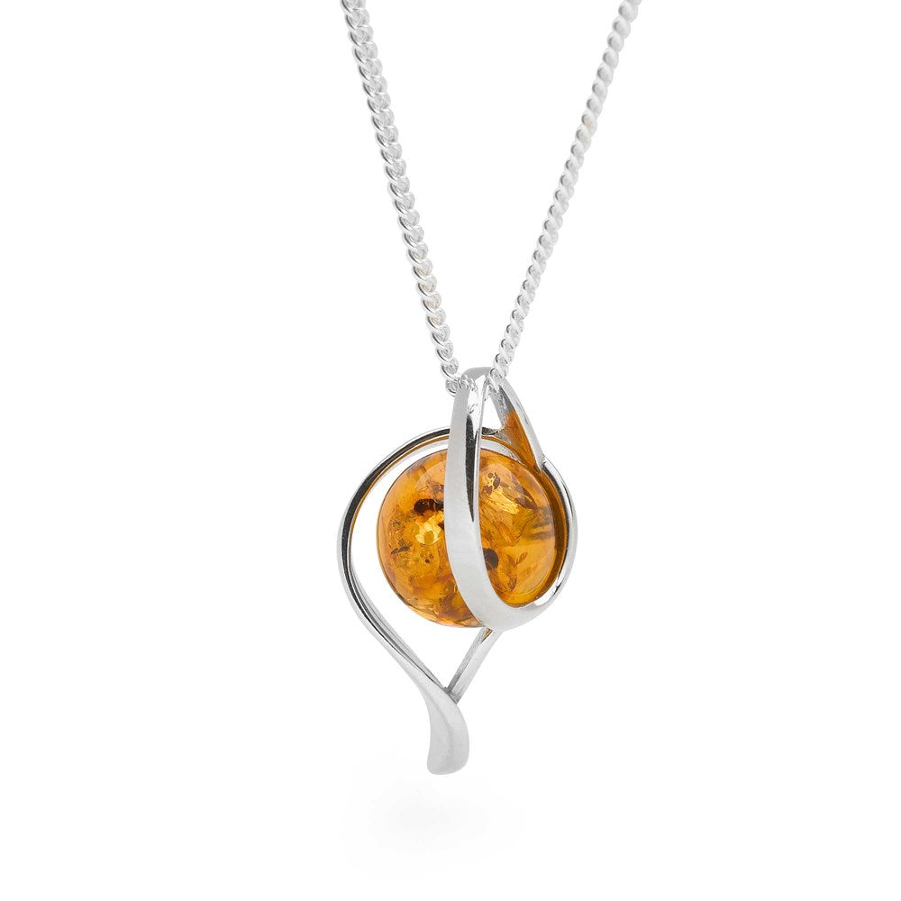 A silver pendant featuring a Baltic amber orb, with a high polish finish and a silver curb chain.