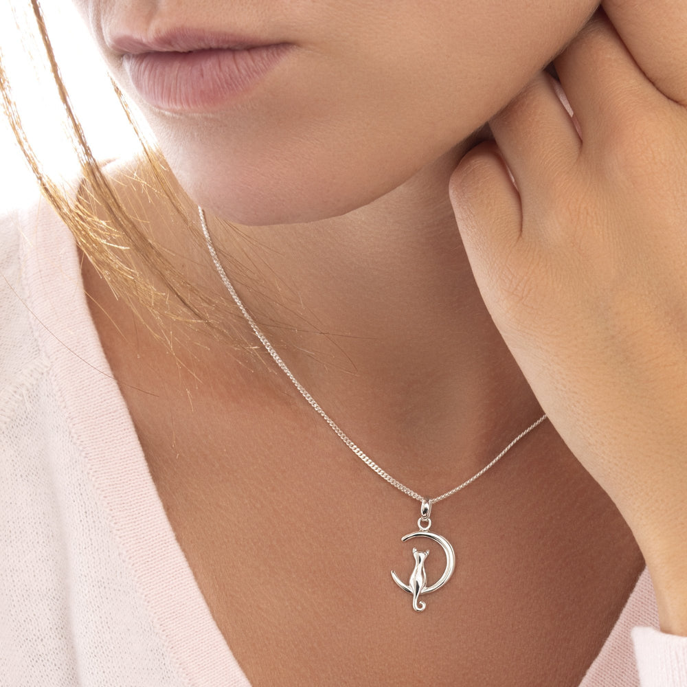 Model wearing 925 sterling silver cat in moon pendant 