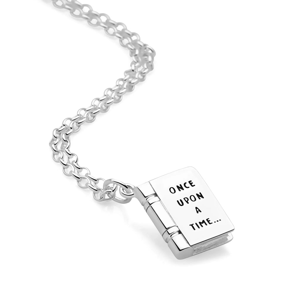 A silver pendant necklace with a small book-shaped pendant engraved with 'Once Upon a Time' on the front and 'Happily Ever After' on the back, with an adjustable chain.