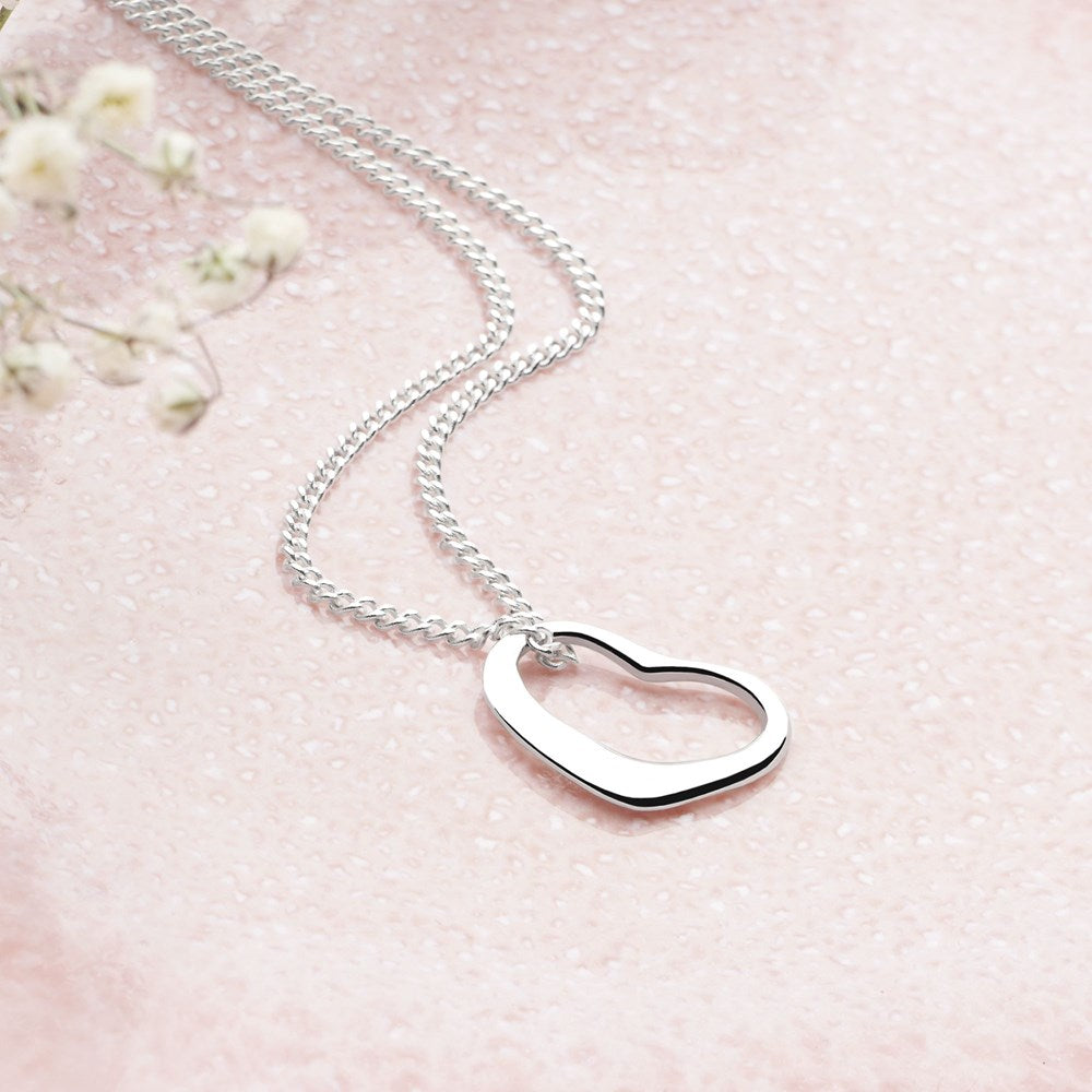 A silver heart-shaped pendant necklace with a curb chain.