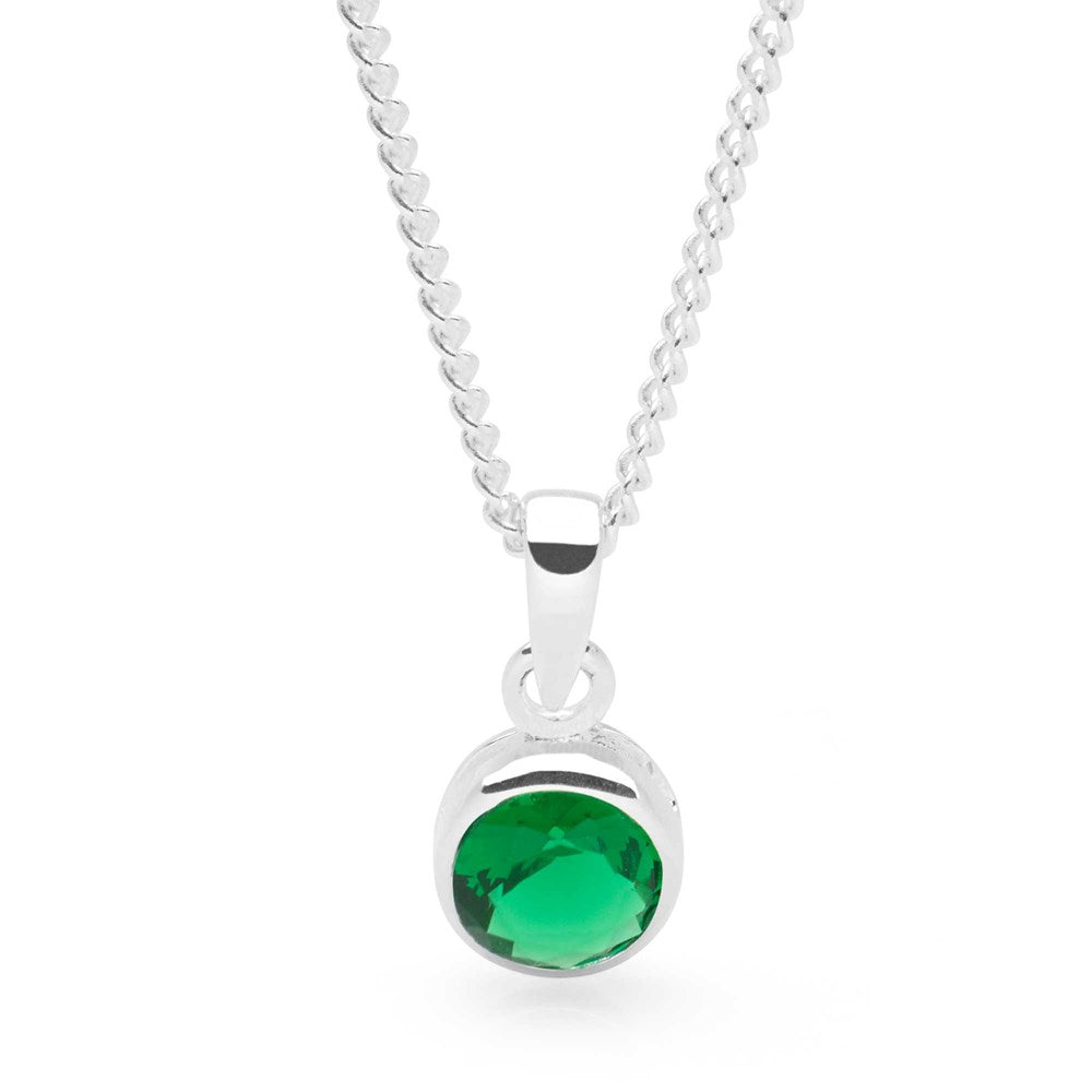 A sterling silver pendant with a bright green emerald cubic zirconia on a curb chain.