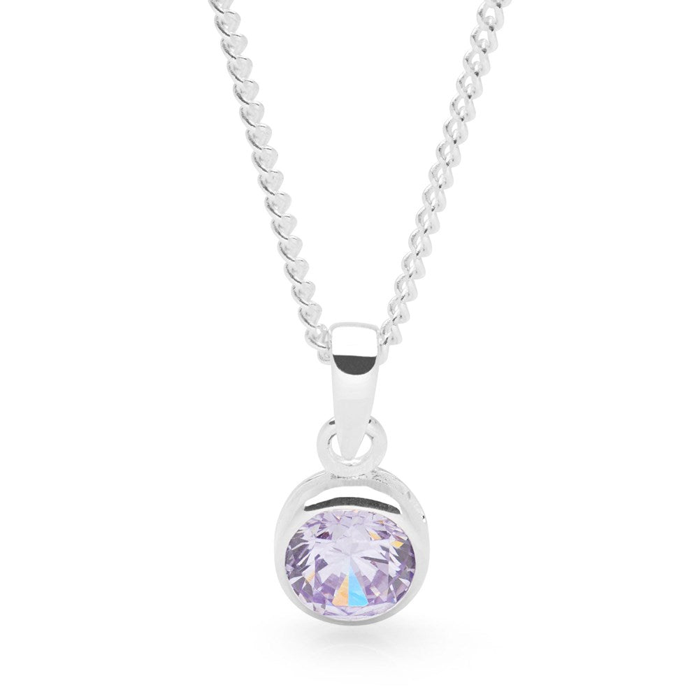 A sterling silver pendant with a lavender cubic zirconia on a curb chain.