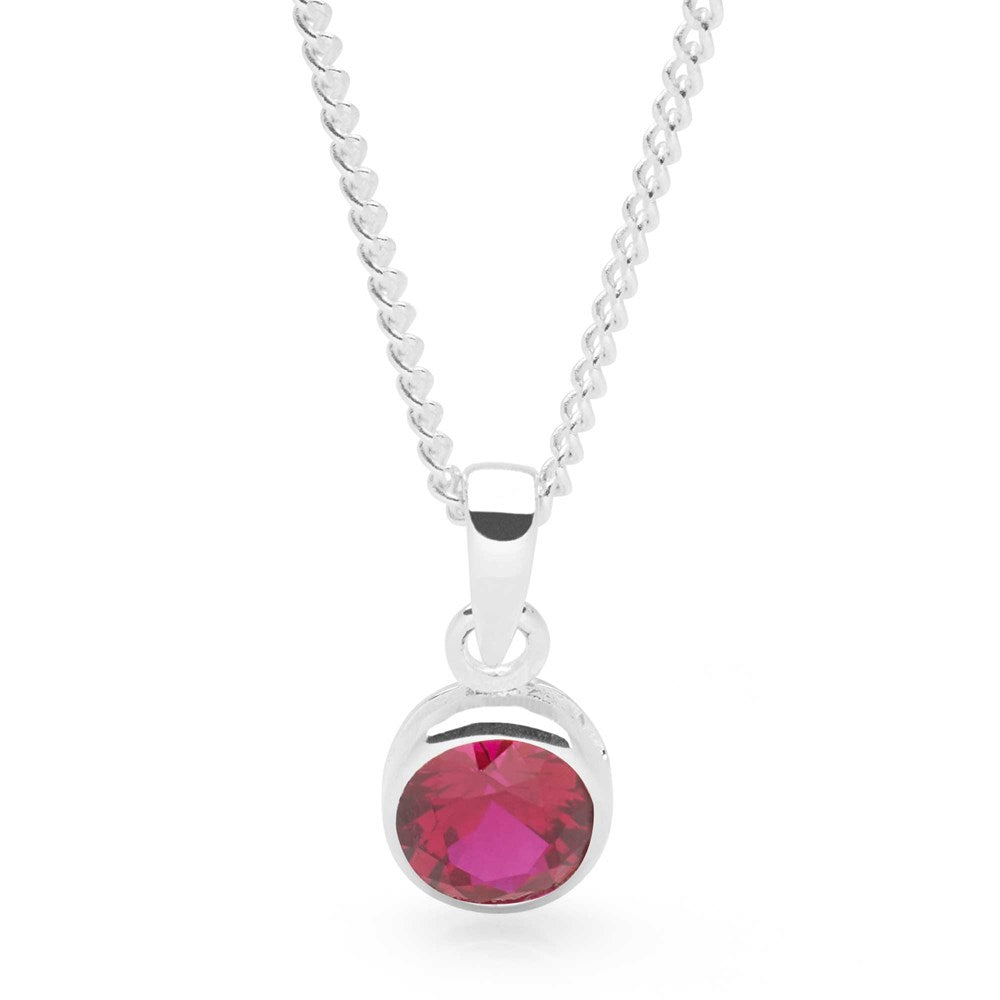 A sterling silver pendant with a red ruby cubic zirconia set in a round, bezel-style setting, attached to a 40cm curb chain.