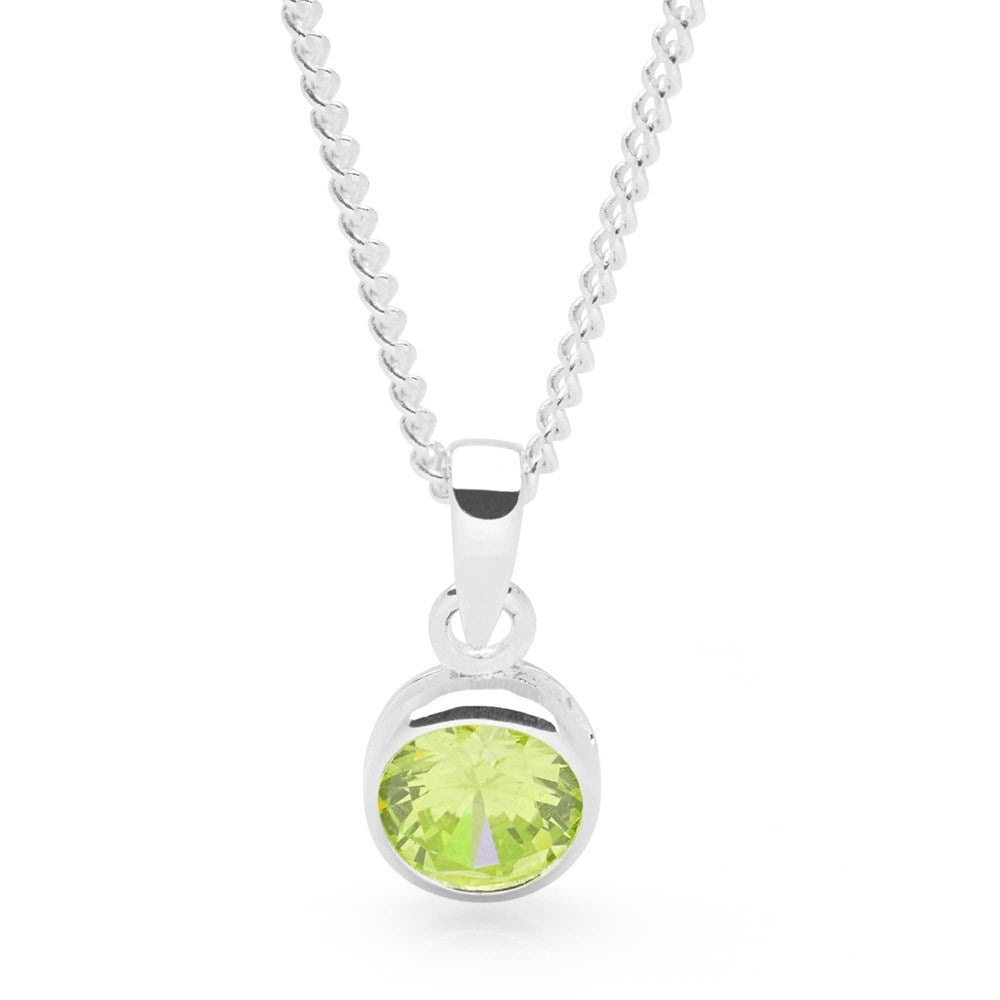 A sterling silver pendant with a light green cubic zirconia on a curb chain.