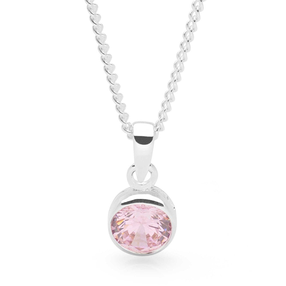 A sterling silver pendant with a pink cubic zirconia centerpiece, attached to a 40cm curb chain.