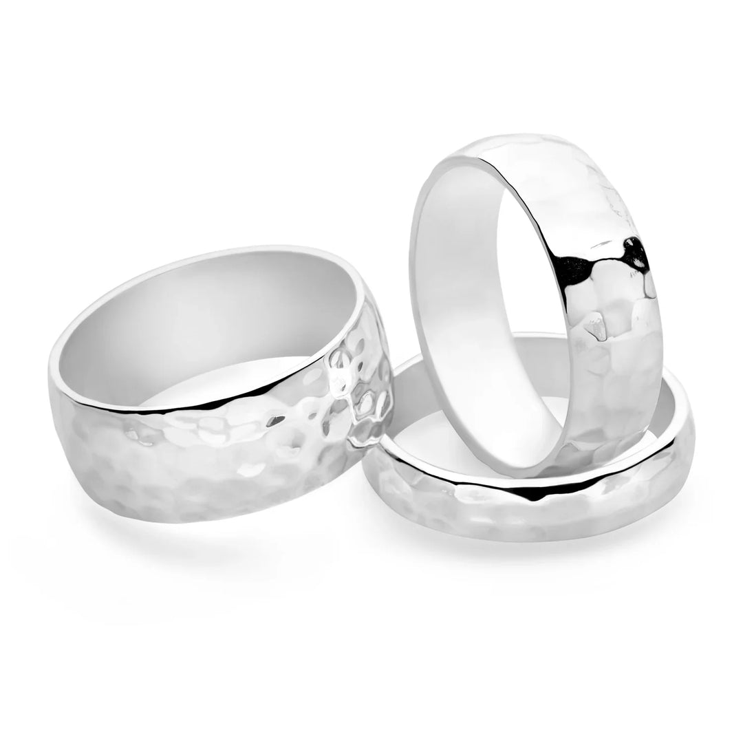 A silver D-shaped band ring with a hammered finish, displayed on a white background.