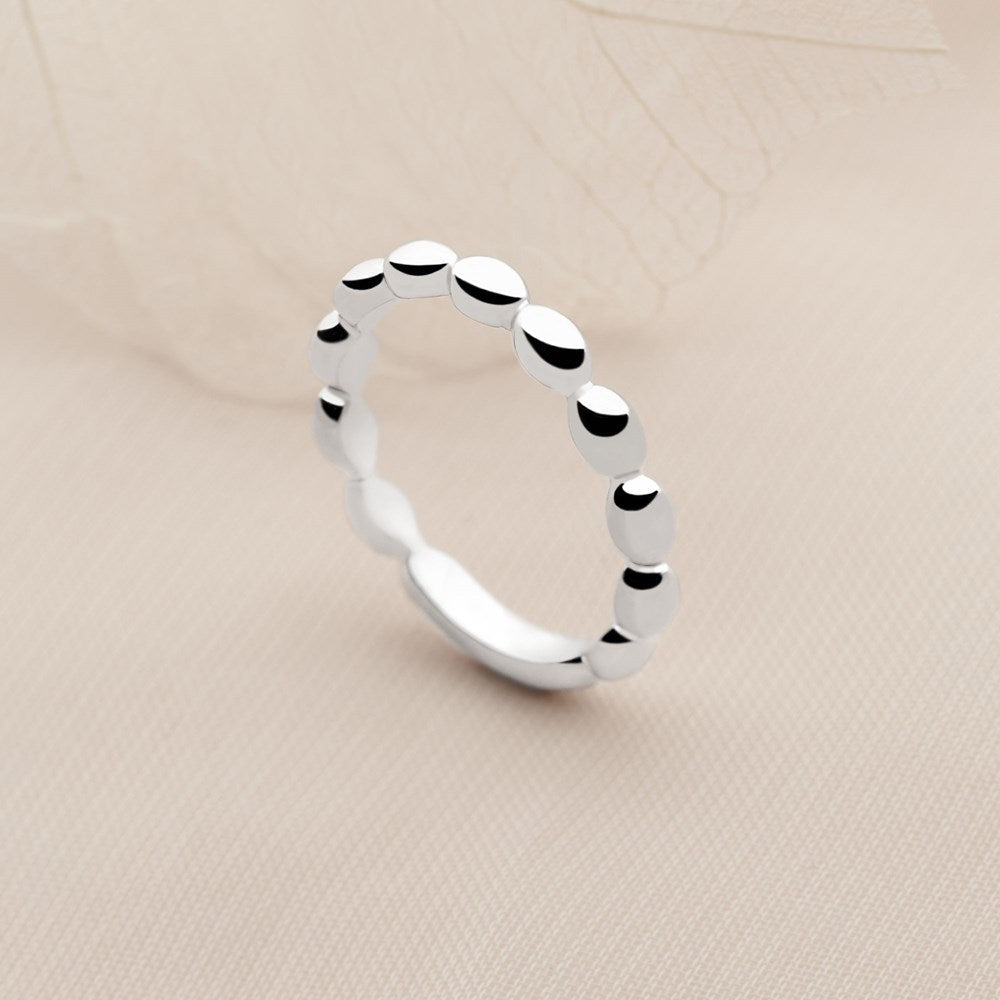 A silver band ring with a pebble design, featuring a high polish finish. 925 sterling silver. 