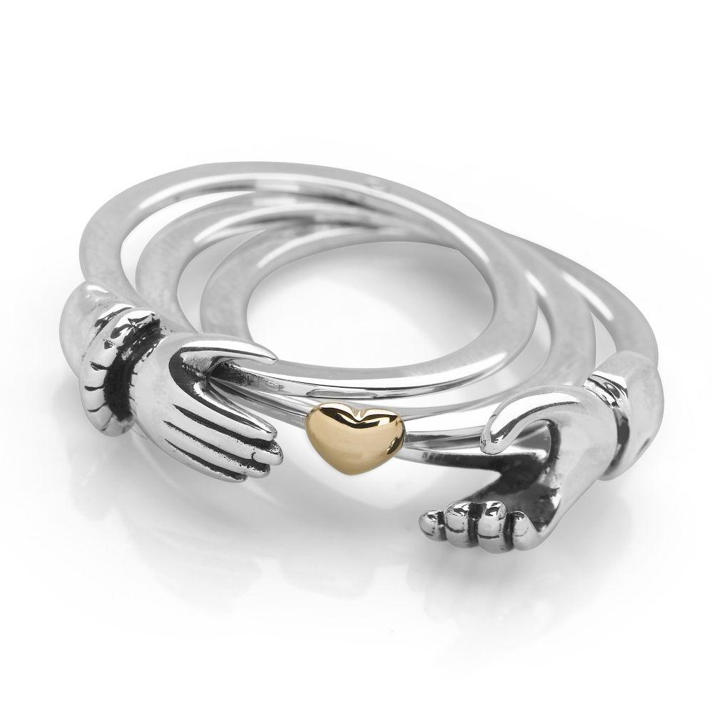 925 sterling silver triple band Claddagh style ring with hands that hide a gold plated heart inside.