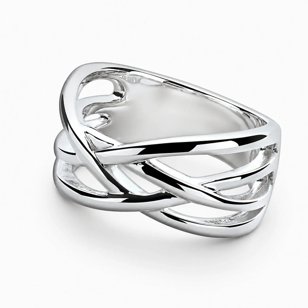 A wide sterling silver crossover ring with smooth, intertwined multi-strand lattice bands.