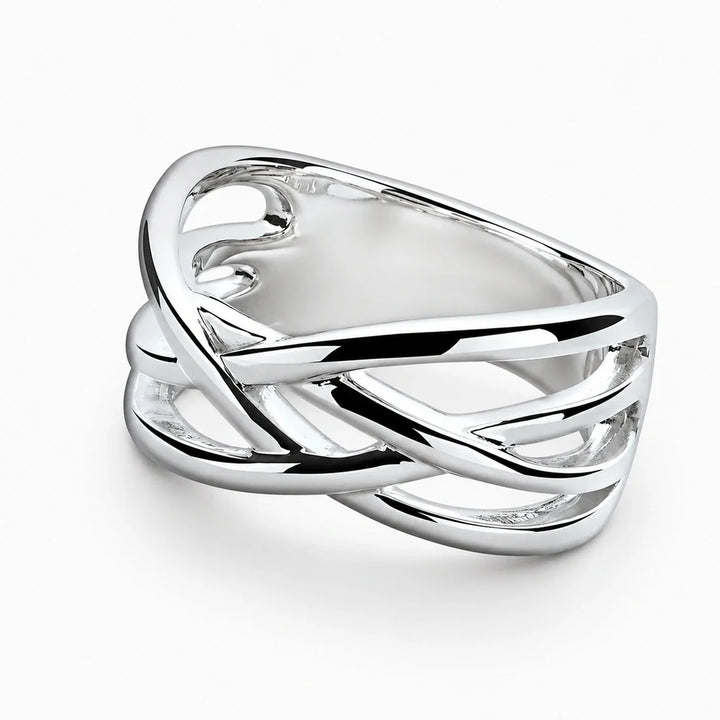 A wide sterling silver crossover ring with smooth, intertwined multi-strand lattice bands.