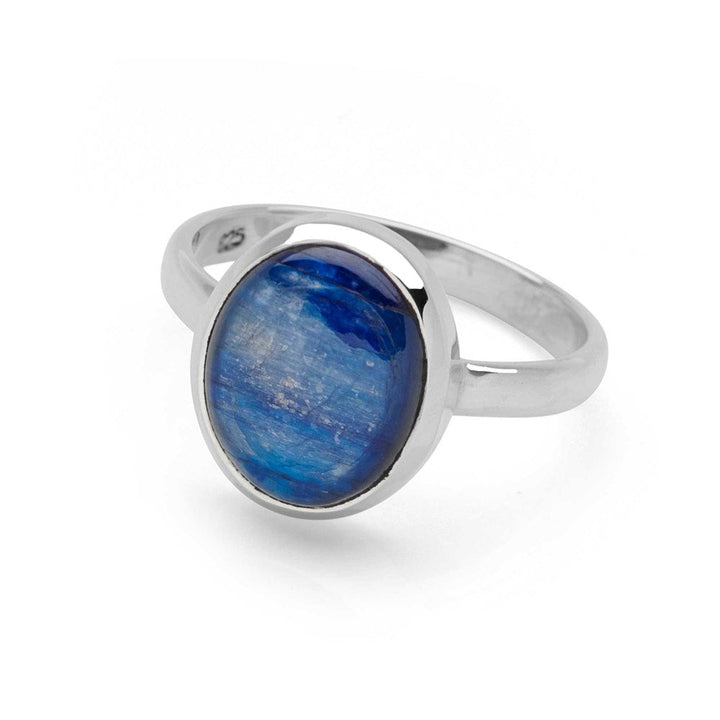 A ring with a central blue kyanite cabochon, set in a high polish finish 925 sterling silver band on white background. 