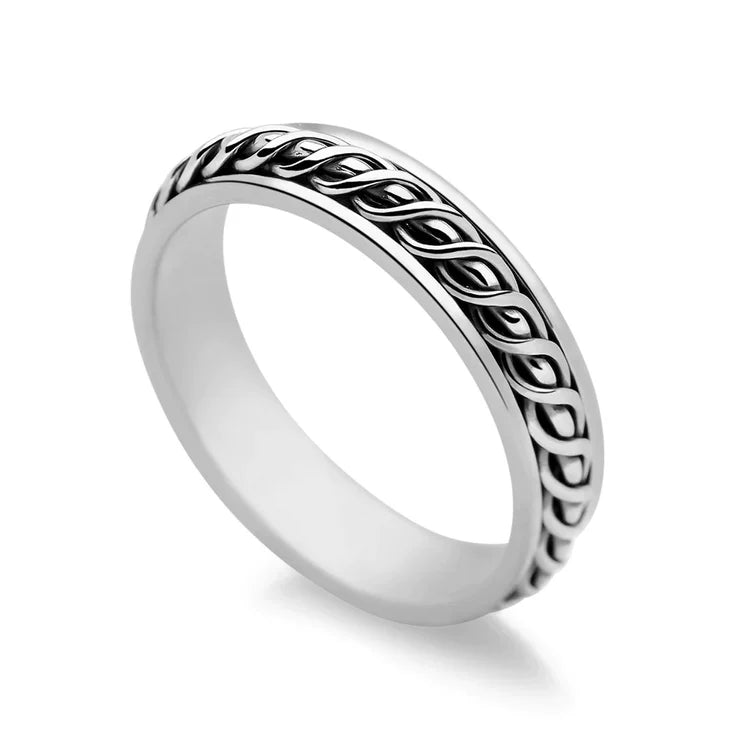 A 925 sterling silver ring with a textured central band that is free to spin, displayed on a white background.