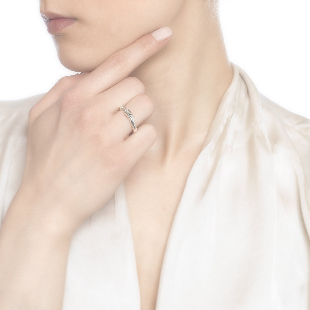 Five 925 sterling silver mini rings on a twisted silver band