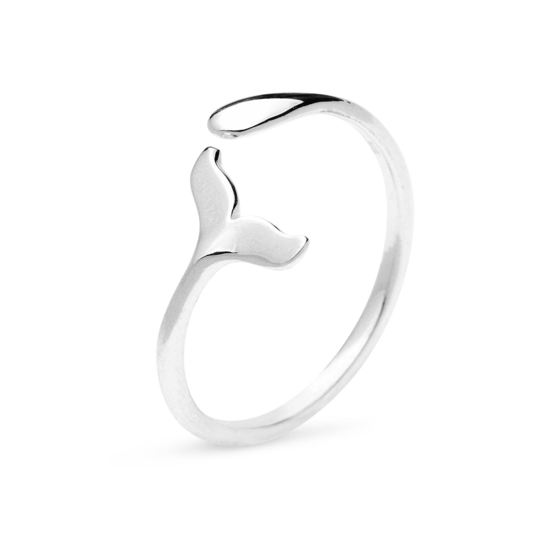 Silver ring with a whale tail design on a white background
