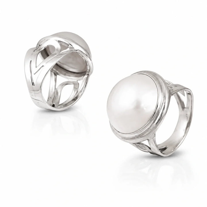 Sterling silver ring, large pearl stone, high polish finish, intricate design on band. 
