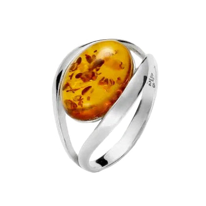 A ring with a large oval Baltic amber stone set in twin silver bands with a high polish finish.